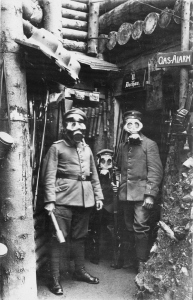 German troops demonstrate their gas mask at a gas alarm post. © Simon Jones